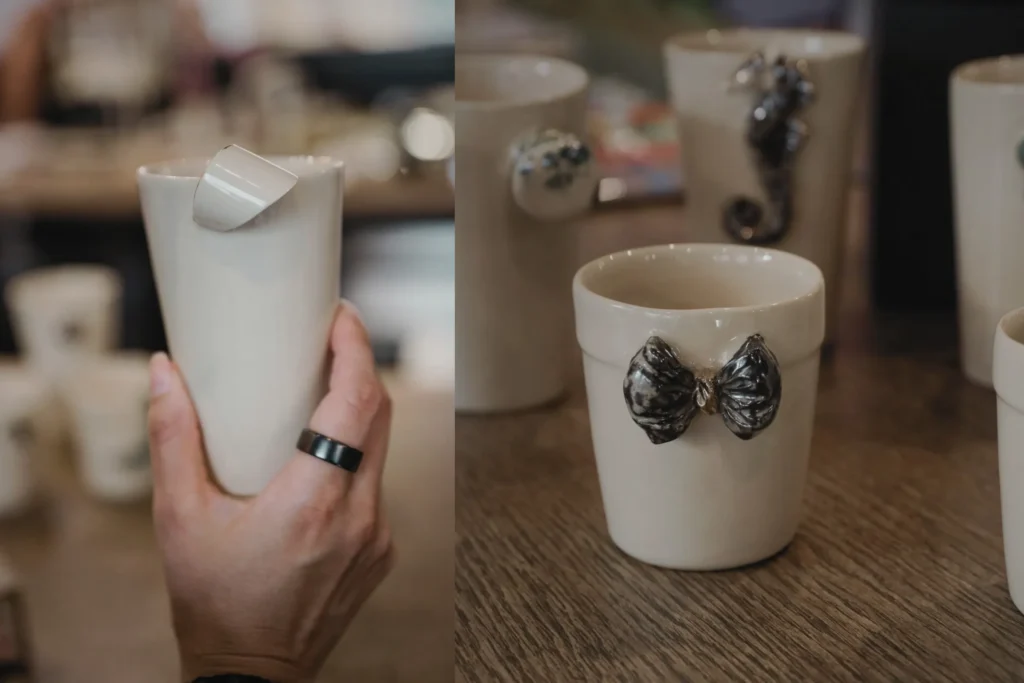 Rankų darbo puodeliai su mini skulptūromis vietoje ąselės